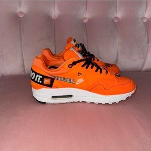 Orange and black patchwork Nike Airmaxs. Slightly used.